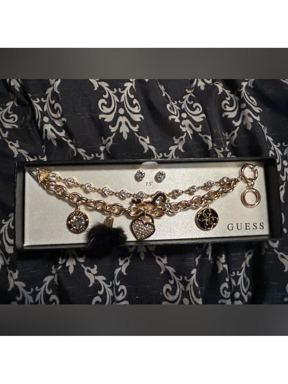 Guess  lose angels  bracelet with matching earrings set